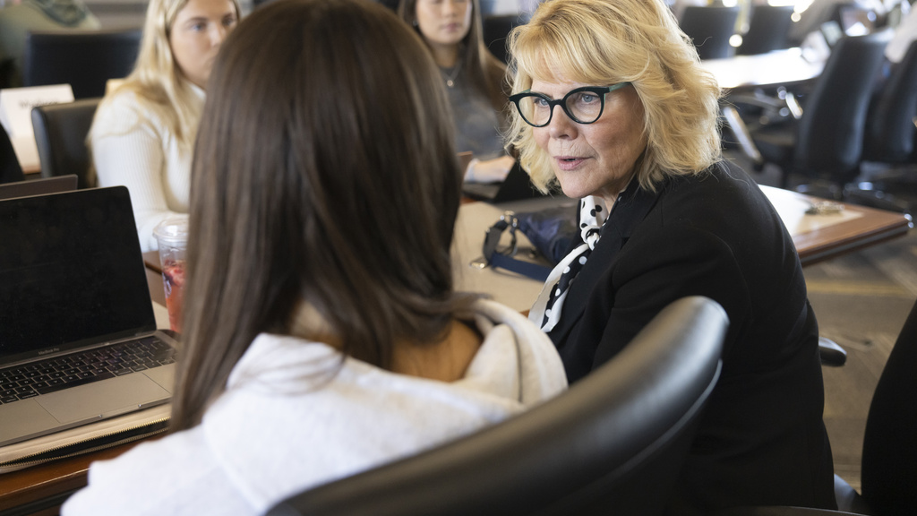 Kimm Harris teaching a group of students